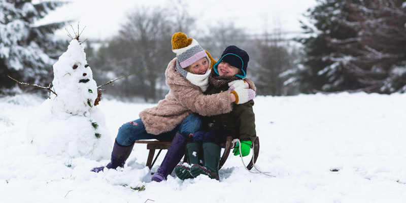 Kids in snow in warm wellies